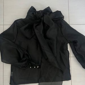 Sheer black blouse with bow